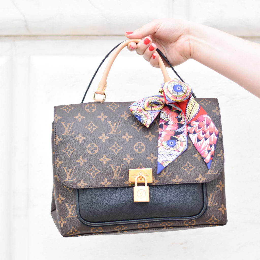 Louis Vuitton Marignan Review. A review of the Louis Vuitton Marignan Bag in Monogram Canvas. This bag comes in 3 colors, noir, sesame, and coquelicot. 