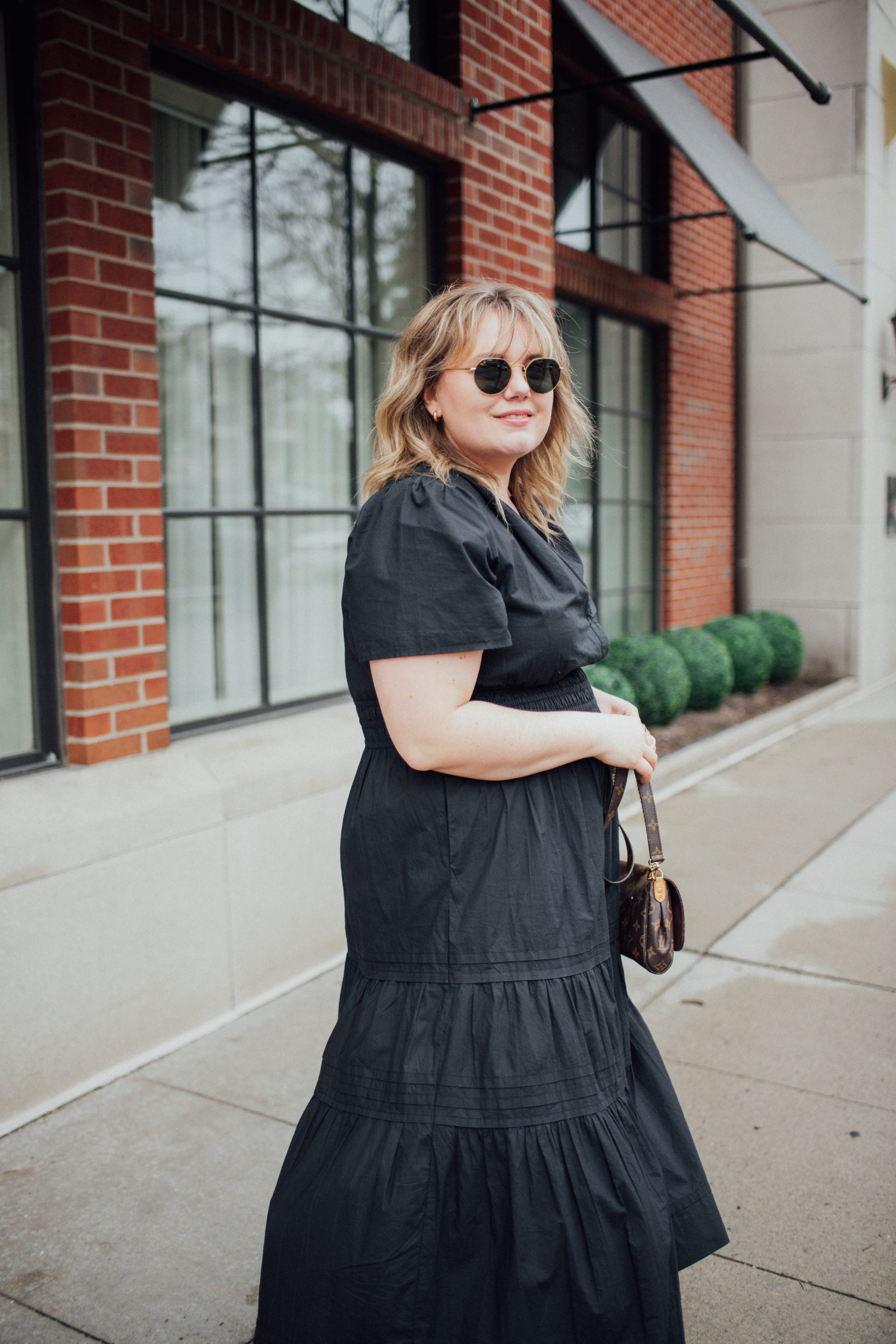 Sharing a plus size black maxi outfit idea with the Somerset maxi dress from Anthropologie. This lovely dress looks great anytime of year.